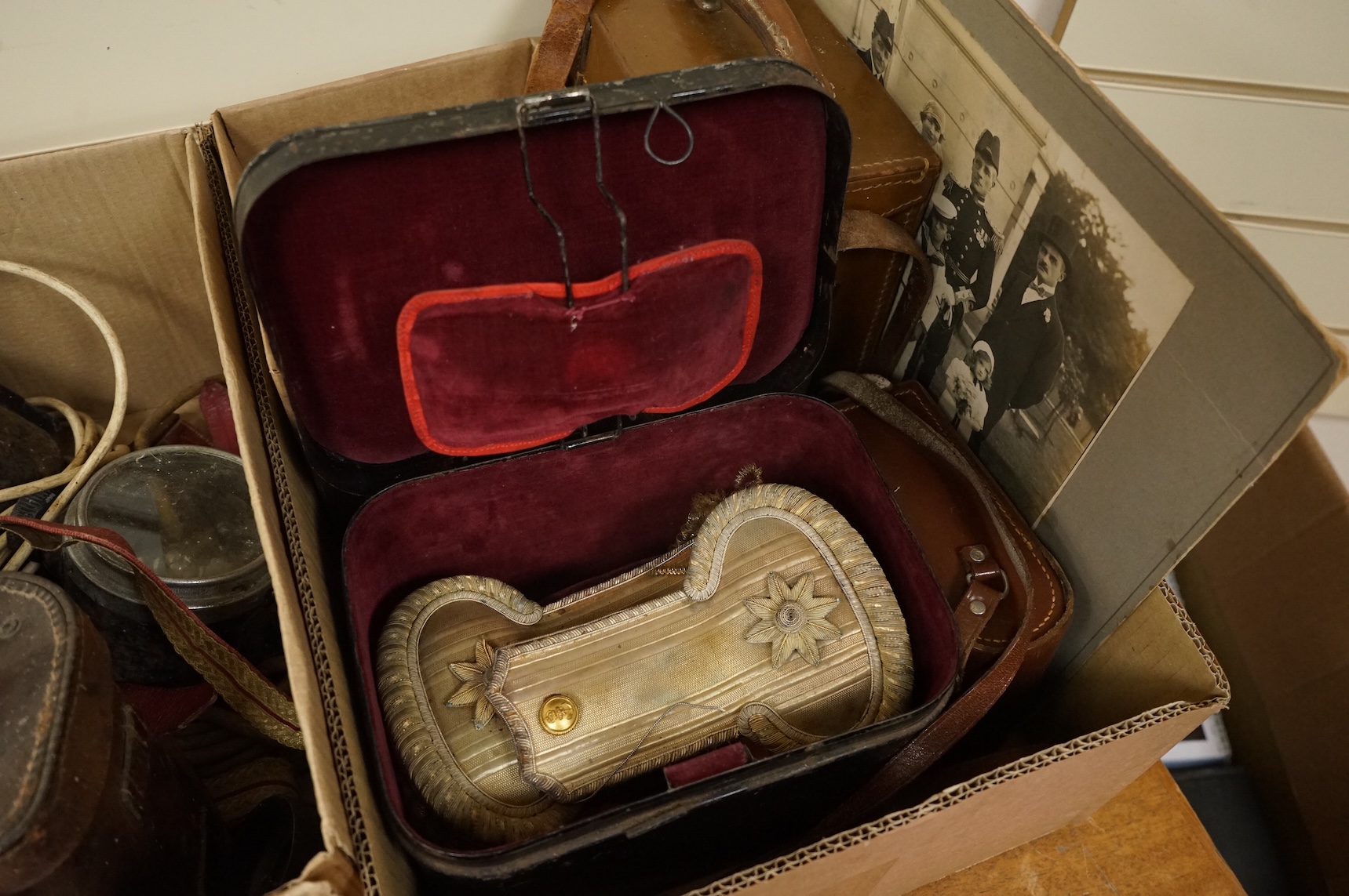 A collection of militaria including; a US Air Force camera Type N-6, a leather cased Bell & Howell Sportster camera and accessories, a pair of periscope binoculars, a leather cased compass by Goerz, Berlin